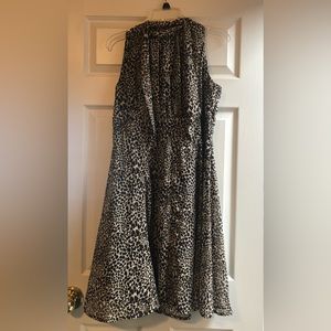 Dark brown/light brown pattern. Tie neck, zip back. A line skirt